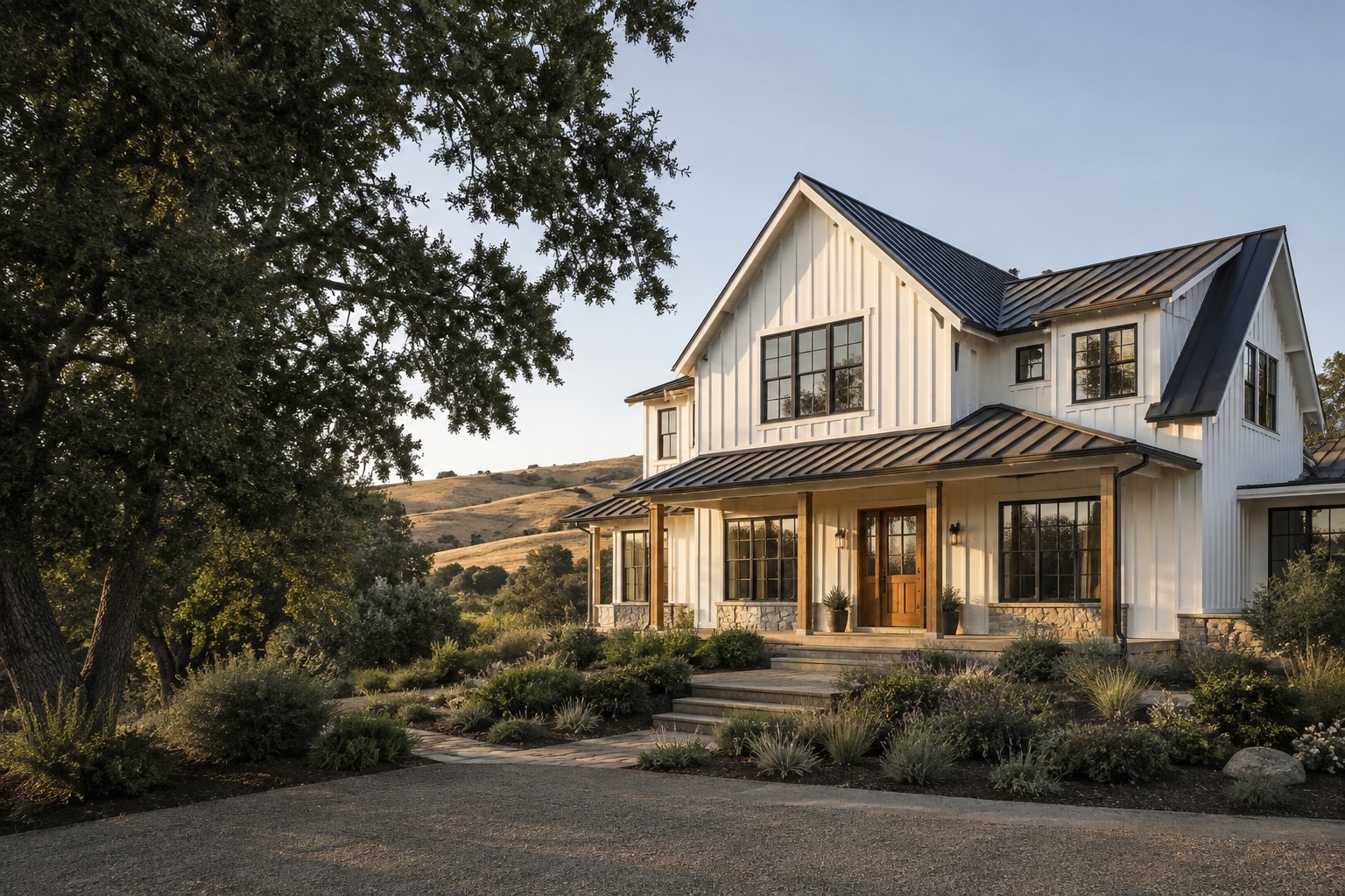 Modern farmhouse with white board-and-batten siding in a warm Northern California landscape
